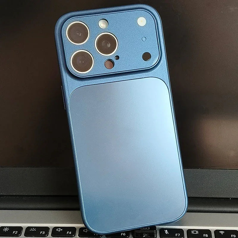 Blue iPhone case with camera cutouts on laptop keyboard, clarioy electronics accessory