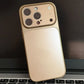 Gold iPhone case with camera cutouts on laptop keyboard, clarioy premium homeware accessory