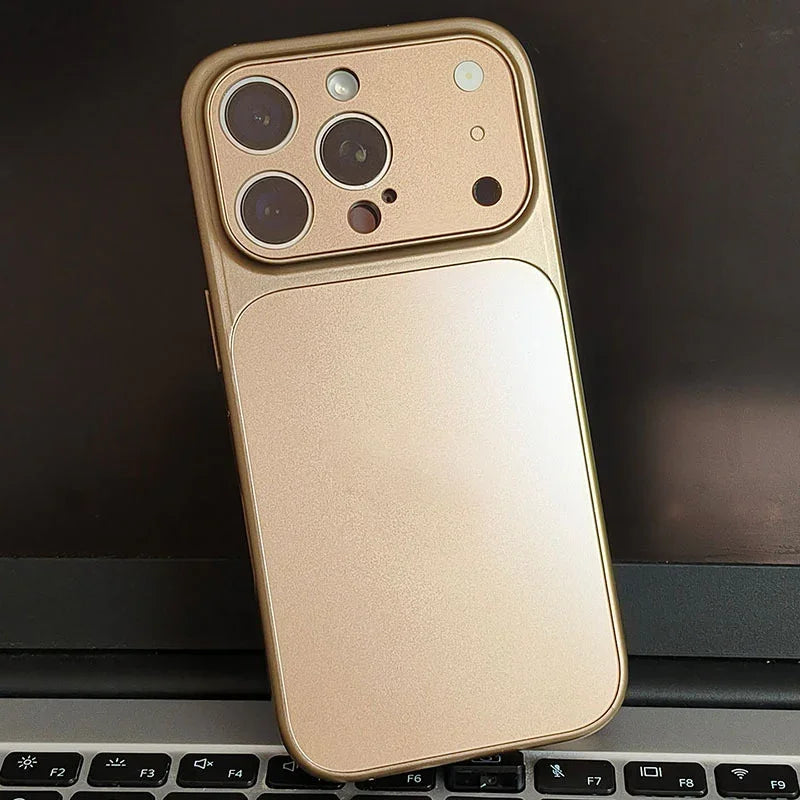 Gold iPhone case with camera cutouts on laptop keyboard, clarioy premium homeware accessory