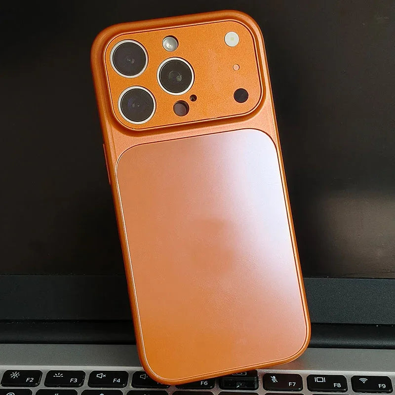 Orange iPhone case on laptop keyboard, clarioy electronics accessory