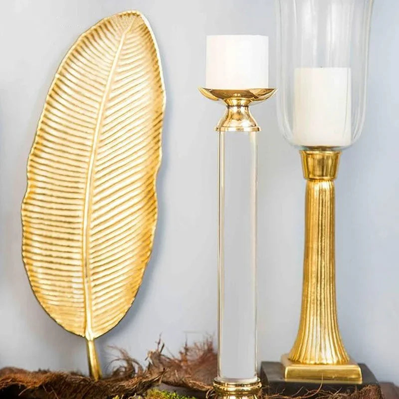 Gold leaf tray and elegant gold candle holders on decorative table, clarioy homeware decor