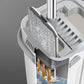 Self-cleaning flat mop with grey microfiber pad and water bucket for home cleaning