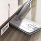 Slim cleaning mop with gray handle cleaning under a cabinet with 5cm clearance on wood floor