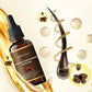Premium essential hair oil serum for growth and scalp detox, with natural ingredients illustration